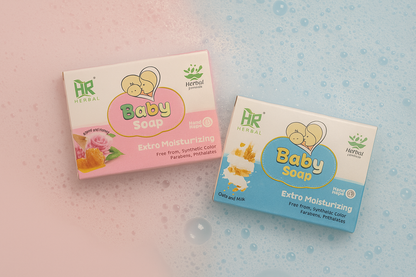 Two boxes of Herbal Baby Soap on a textured background